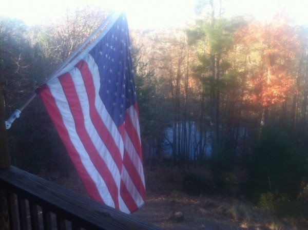 overlooking the lake from the deck with the American flag